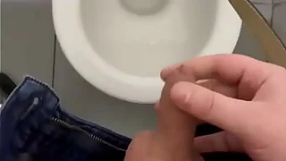 My dick cums in a public toilet close up